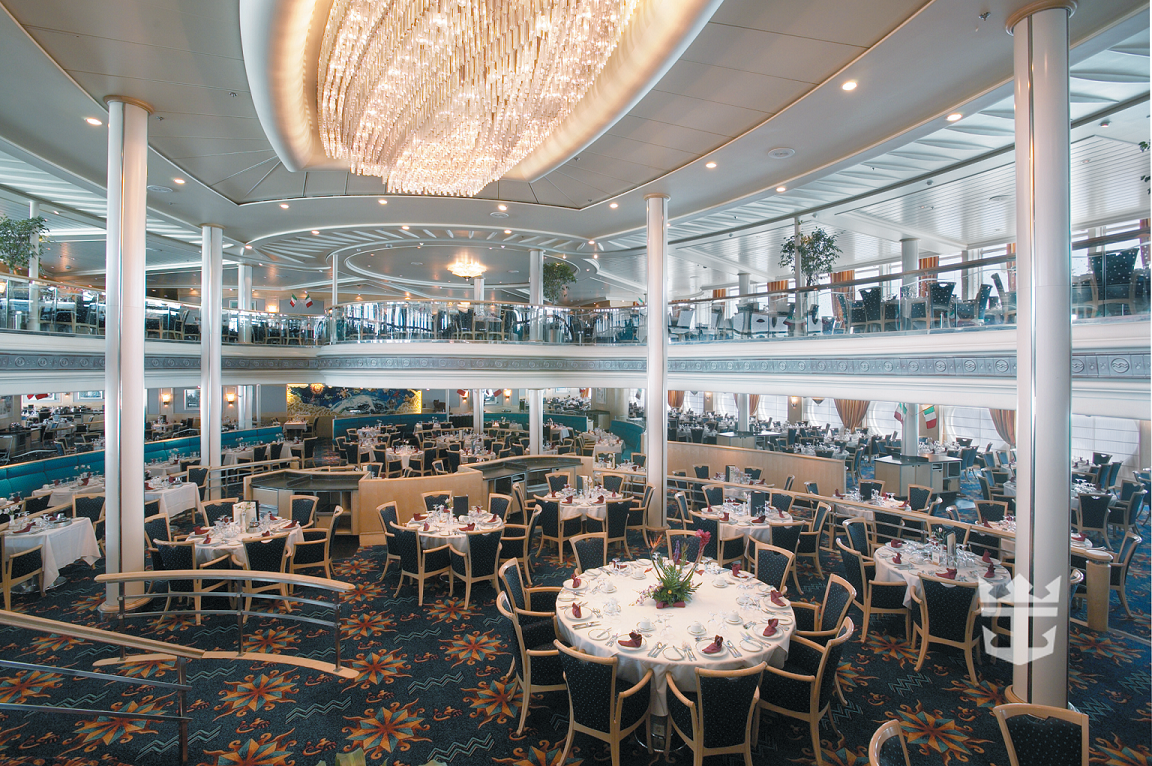 View of dining area in Aquarius dining room, underneath a chandelier